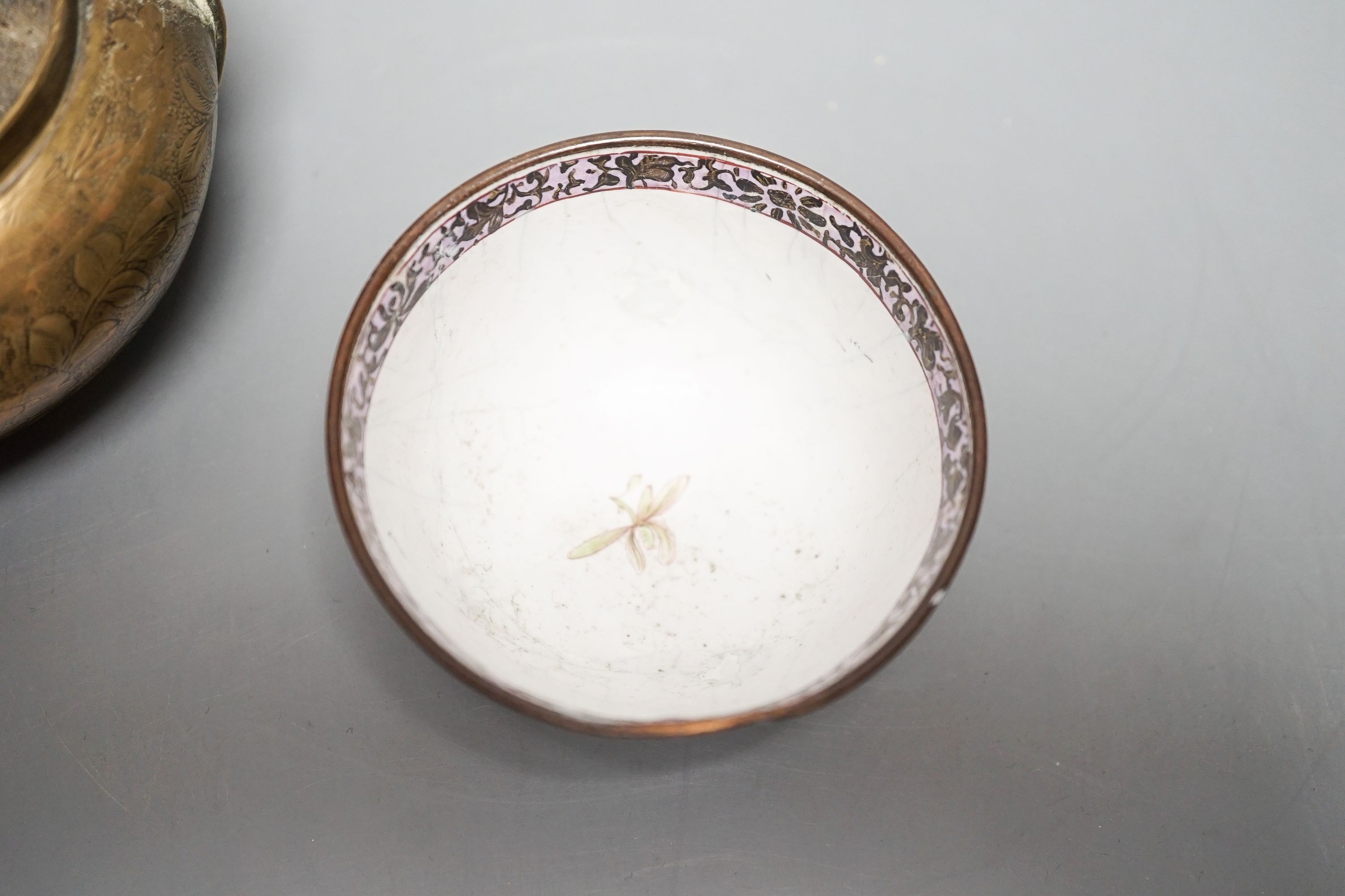 A Chinese bronze hand warmer, 11.3cm and an 18th century Chinese Canton enamel cup